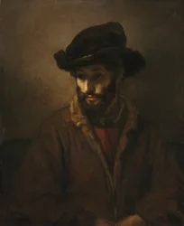 Un homme barbu portant un chapeau